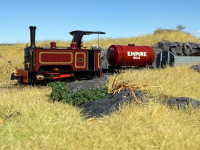 009 Society Exclusive Sirdar in dark blue with a half cab passing through a summer landscape of straw coloured grass