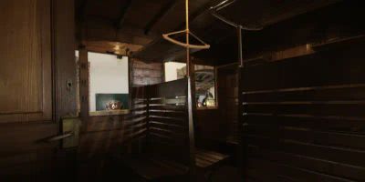 The inside of a dark varnished wooden railway carriage in the museum at Tramway de Pithiviers à Toury in France, with high backed wooden slatted seats