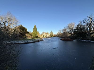 View of Scotney Castle from the footbridge over the lake from the western most point of the lake.