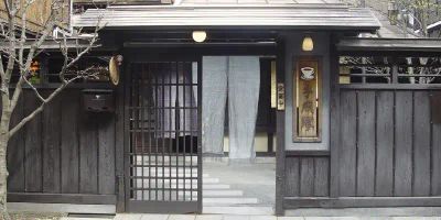 Street view of an entrance to a machiya cafe in Takayama Japan.